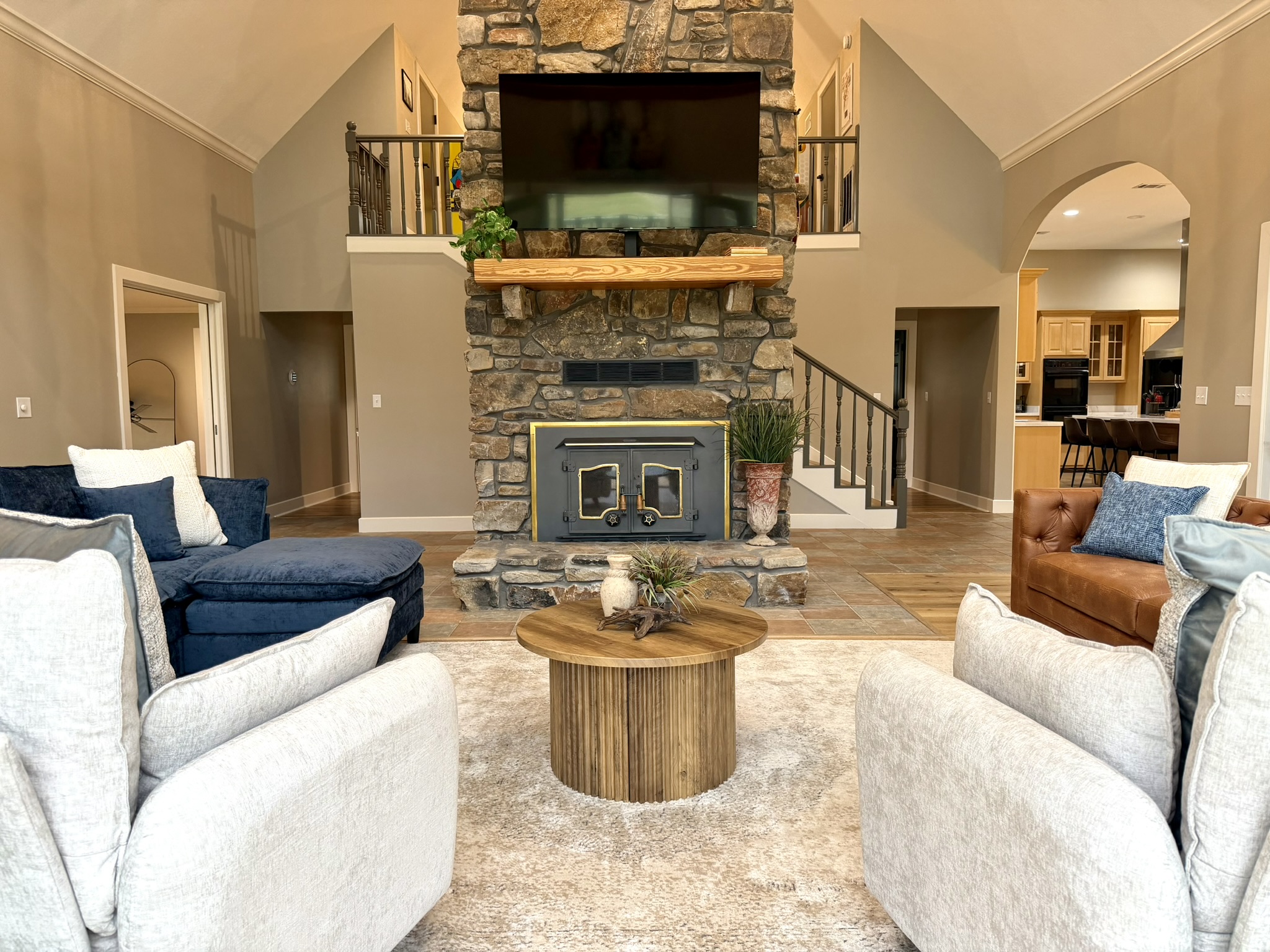 Southern Delight living room with stone fireplace and vaulted ceilings